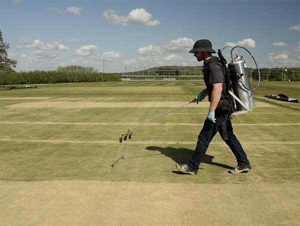 Eric De Boer, a graduate student at the University of Arkansas, sprays a late-season wetting agent application as part of his research. Photo by the University of Arkansas