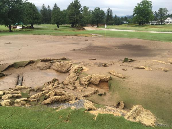 Superintendent Josh Pope knew trouble was ahead when the No. 15 green, here covered in silt, was overwhelmed by floodwater from Howard's Creek.