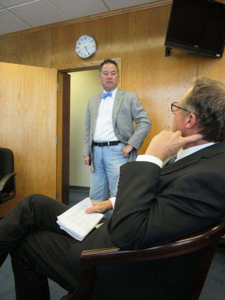 Jim Ferrin (foreground) listens as California Assemblyman Phil Ting speaks during the California Alliance for Golf's visit to Sacramento on April 27.