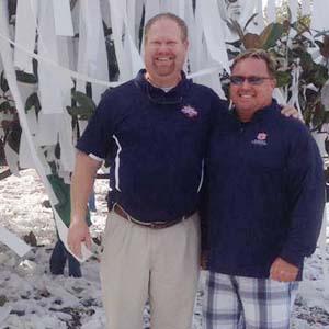 Cory Blair, left, and Larry Balko at TP-festooned Toomer's Corner in Auburn, AL.