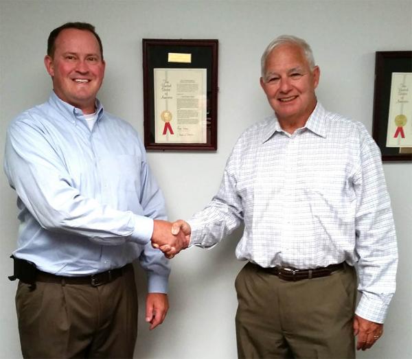 John Paddock, left, takes over ownership of DryJect from founders Chris des Garennes, right, and Peter van Drumpt.
