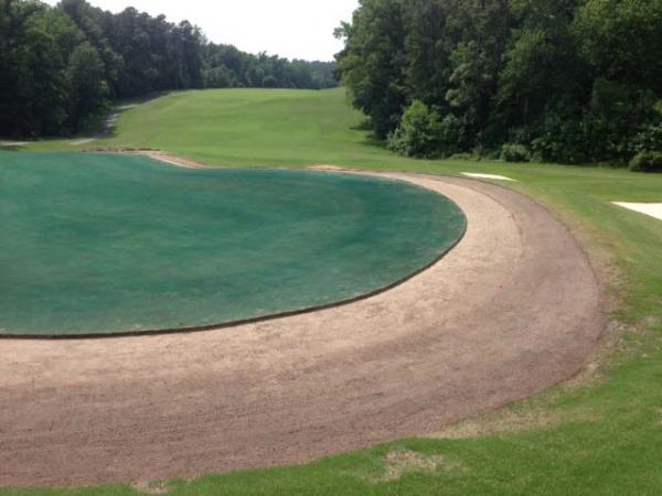 The contrast in colors shows how much square footage was recaptured to bring the No. 9 green back to its original contours.
