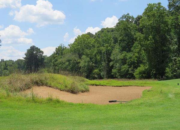 It often is hard to tell where the grass ends and the bunkers begin at Rivermont.