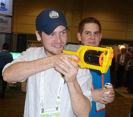 Chris Duffy of SUNY Cobleskill tries his luck at killing monsters in the Direct Solutions booth at GIS.