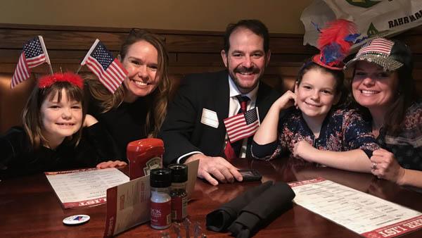 Pat O'Brien, center, celebrates his U.S. citizenship with, from left, daughter Maeve, sister-in-law Suzy Henke, daughter Brynna and wife Jen.
