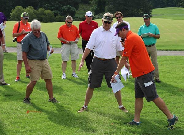 Clemson's guide for professional turfgrass managers is like having Bert McCarty (wearing the visor in center) and Bruce Martin at your disposal 24 hours a day.