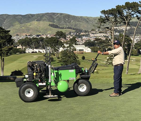 Thomas Bastis is a fan of new technology, like the Air2G2, here being operated by David Escobar at the California Golf Club of San Francisco.