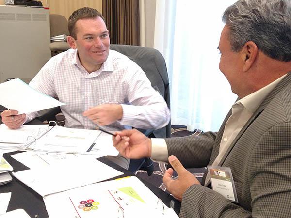 Andrew Updegrove of The Country Club in Brookline, Massachusetts, here going through a negotiations drill with Jorge Croda at SBI, has converted his garage into a woodworking shop.