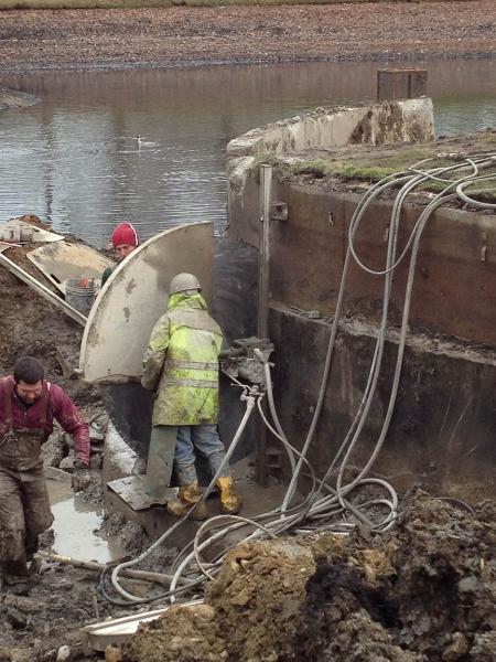 Workers at Scioto Country Club battled harsh winter conditions when removing a moat from the golf course.