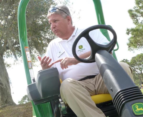 John Deere product manager Tracy Lanier discusses the company's new A Model mower series at demo day during this year's Golf Industry Show in Orlando.
