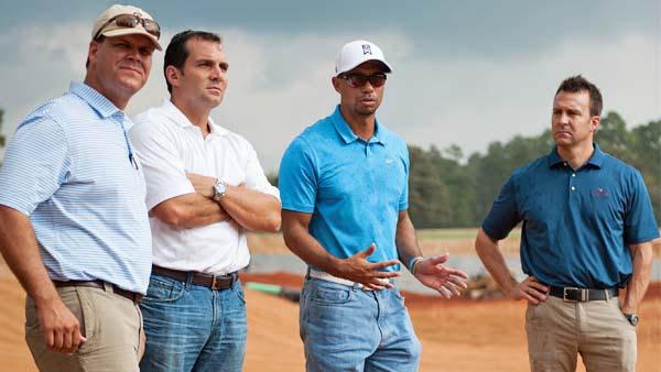 Tiger Woods discusses plans for his Bluejack National design in Texas with superintendent Eric Bauer, Andy Mitchell, president of Lantern Asset Management, and Brandon Goodyk, director of development (left to right). The Houston-area course opened in 2016 and was the first designed by Woods. Plans for another Woods-designed course in North Carolina have been suspended.
