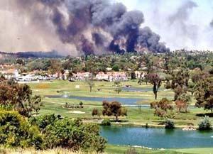 The Poinsettia Fire burns in May near the golf course at the Omni La Costa Resort and Spa in Carlsbad, California. Photo by David Cordero via Twitter