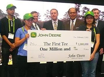 Youths participating in The First Tee of San Diego program accept a $1 million donation from John Deere at last year's Golf Industry Show. Deere has since developed a First Tee exhibit that will be on display at this week's Valero Texas Open as well as at other PGA Tour events this year.