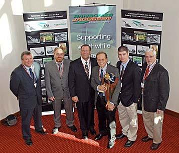 Eric Kulaas, holding award, accepts the 2008 Edwin Budding Award.