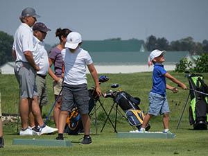 John Cook, left, and his family have been backers of junior golf for many years.