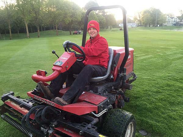 Ohio State student Nate McKinniss, who is interning in Ireland through the summer, mows the intermediate rough at The K Club in preparation for The Irish Open.