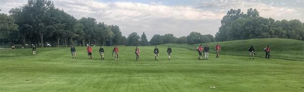 Volunteers blow clippings from the fairways during the Solheim Cup.