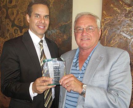 Ted Horton, CGCS (right), receives the award named in his honor from CGCOA executive director Marc Connerly.