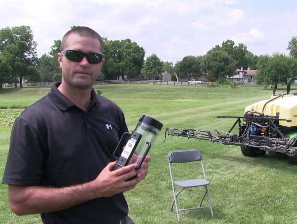Zane Raudenbush, Ph.D., of Ohio State ATI likes to use the SpotOn spray calibrator to make sure spray nozzles are performing at peak efficiency. Photo by John Reitman