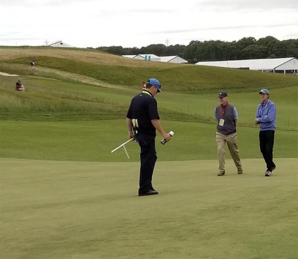 Shinnecock Hills superintendent Jon Jennings (center) and Brad Klein of the Golf Channel walk the course before Friday's second round. Photo by Anthony Minniti via Twitter (@aminniti147)