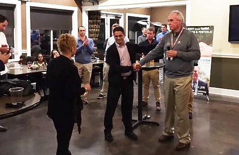 Mike Morales receives congratulations from Peter McCormick, as Susan Coldiron (l) approaches