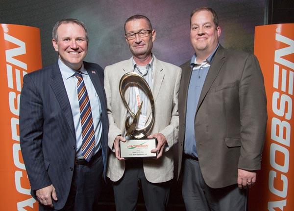 From left, Jacobsens David Withers presents Neil Beech and Rob Cooke of G.C. Duke Equipment with the North American Dealer of the Year award.