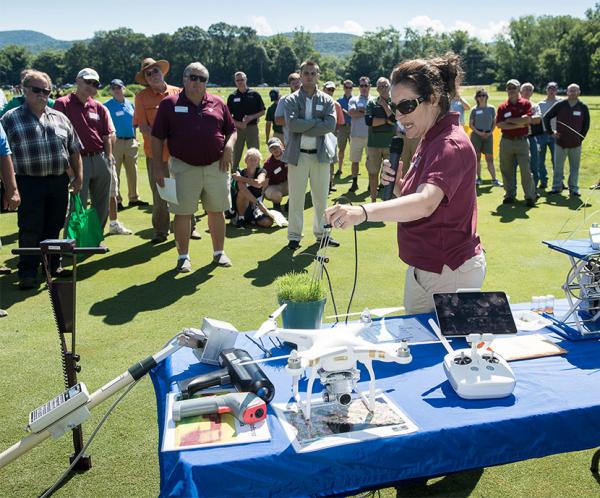 Michelle DaCosta, Ph.D., keeps the crowd's attention at a recent UMass field day.