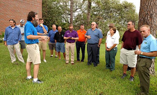 University of Florida pathologist Phil Harmon, Ph.D., (with beard) takes workshop attendees outside his lab in Fifield Hall to demonstrate that turf disease is never very far away from home. Photos by John Reitman