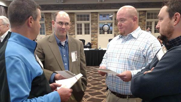 Ryan Cummings, second from left, negotiates with Chad Dorrell, Derrick Wozniak and Eddie Roach at SBI '17.