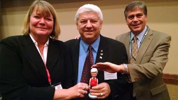 Pamela Sherratt and Karl Danneberger, Ph.D., tease John Street, Ph.D., about his retirement at last year's Ohio Turfgrass Foundation Conference and Show in Sandusky.