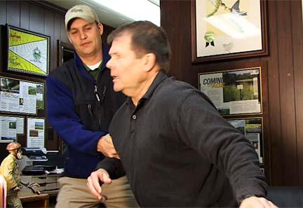 Andy Hutchinson (left) removes a hostile Randy Wilson from the golf turf maintenance facility at Stone Mountain.