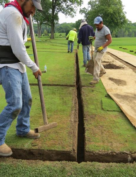 Crews from XGD Systems install drainage in a greens approach at Moraine Country Club. Photo by John Reitman