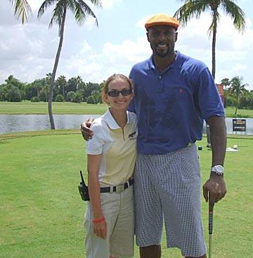 Laurie Bland with former NBA player Alonzo Mourning at Doral.