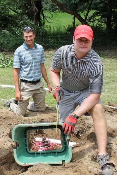 Scott Griffith, right, and Jason Tharp of Druid Hills Golf Club in Marietta, Georgia, help with a service project at an Atlanta-area boys home in 2014.