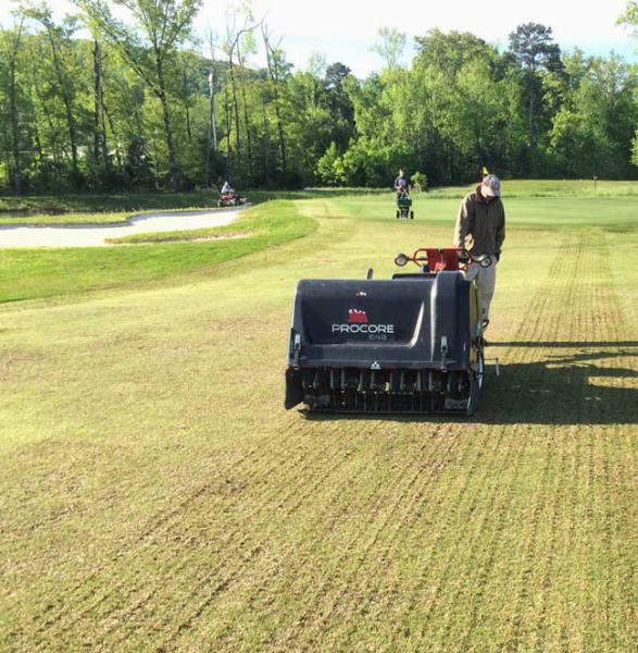 Aerating fairways at Harrison Bay.