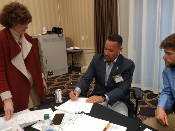 Carlos Arraya, center, of Bellerive Country Club in St. Louis, shares some thoughts with Amy Wallis, Ph.D., of Wake Forest University and fellow superintendent Peter Bachman of San Jose (California) Country Club at this year's Syngenta Business Institute.