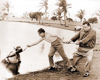 South Florida once was a golf playground for the rich and famous like Jackie Gleason, right, and Richard Nixon, as they pull a golf ball diver from the water in 1967.