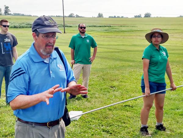 University of Kentucky entomologist Dan Potter, Ph.D., and doctoral candidate Bernadette Mach (right) discuss the relationship between pollinators and neonicotinoid insecticides.