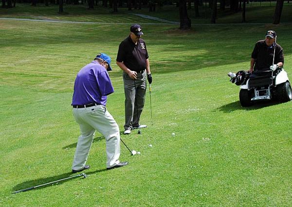 A group of veterans play at American Lake Golf Course in Tacoma, Wash.