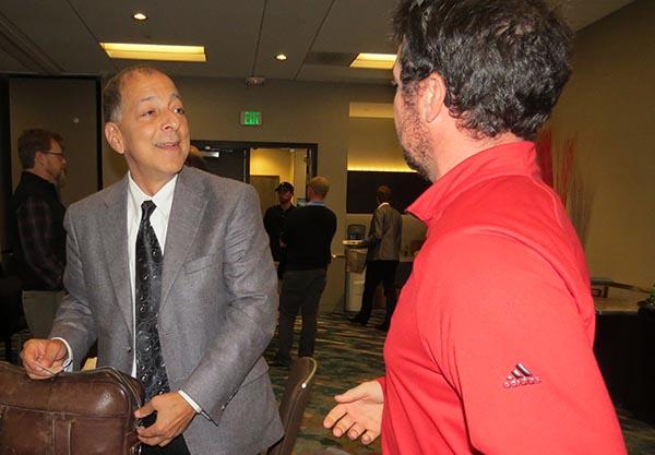 Armen Suny, left, shares some career development advice with Daniel Quinn of Round Hill Country Club.