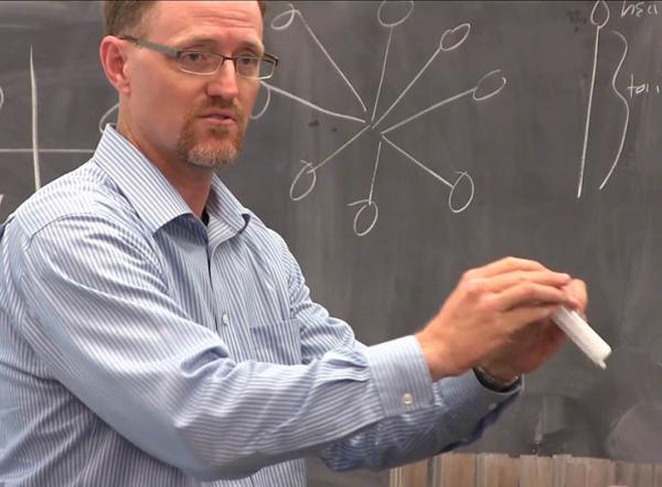 Travis Shaddox, Ph.D., of the University of Florida explains a test measuring the effects of soil surfanctants. Photos by John Reitman