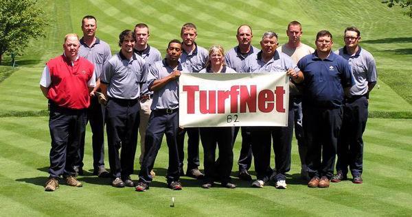 John (in red) with his staff at the Country Club of York.